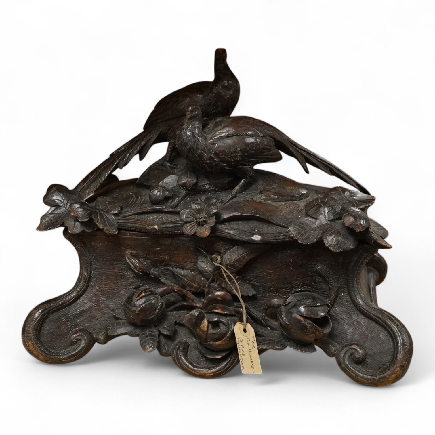 A 19th century Black Forest trinket box, carved with flowers, the cover carved with two pheasant and interior lined with blue silk. 28cm high x 34cm wide., Condition - would benefit from a clean and re polishing.